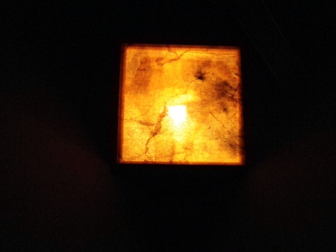 Lantern sculpture. rust on linen, incandescent bulb, duct tape
