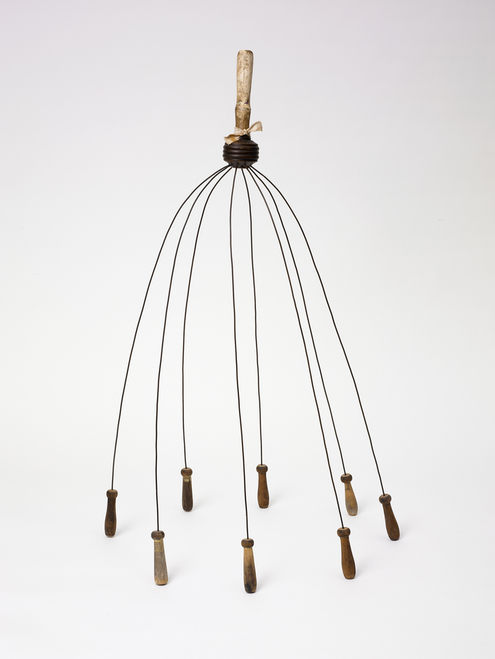  Pam J. Brown Sculpture  14 ga. steel wire, wooden handles, fabric, color xerox.
