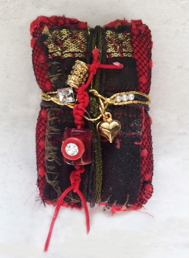 Ellen Devens Sculpture Made from vintage textiles, these handmade and sewn Healing and Memory Bundles are bound and corded with varying materials securing important elements, stones and embellishments.    