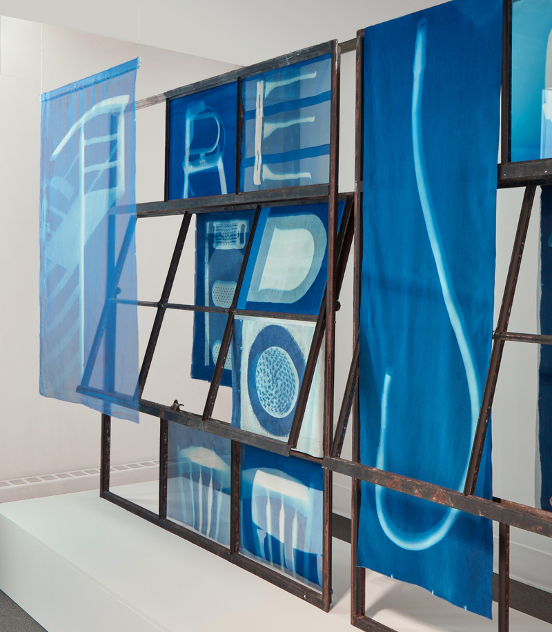 Leslie Hirst of rock and air cyanotype prints on silk, cotton and glass mounted to salvaged industrial window frames