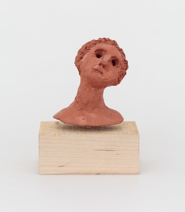 William Staples Sculpture Clay with wood base.