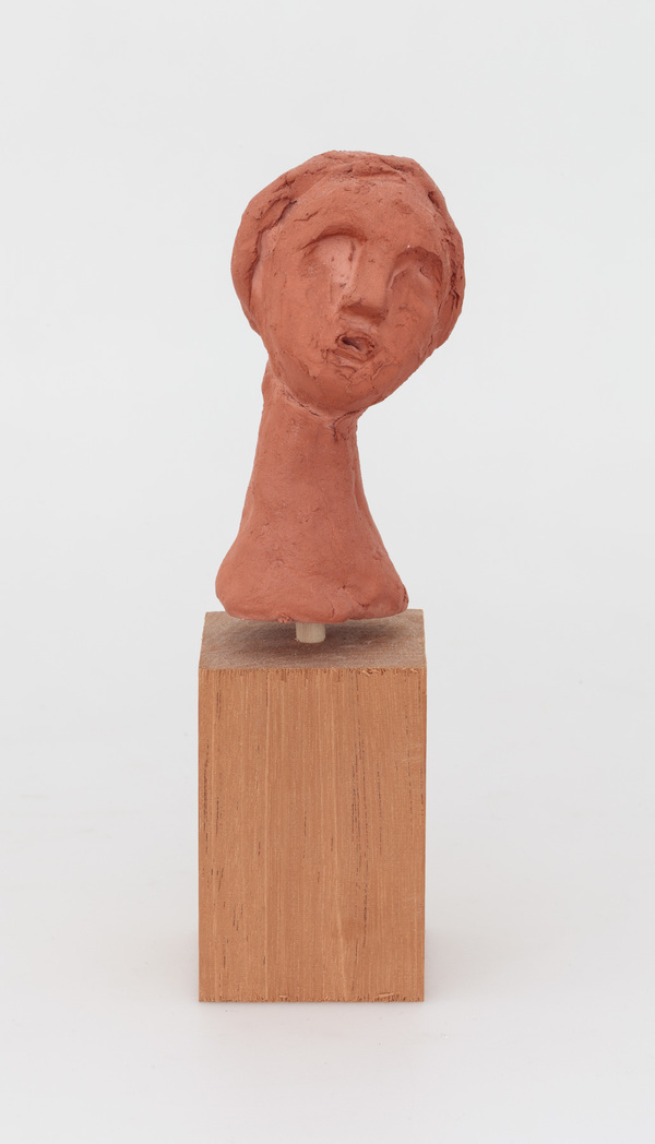 William Staples Sculpture Clay with wood base.